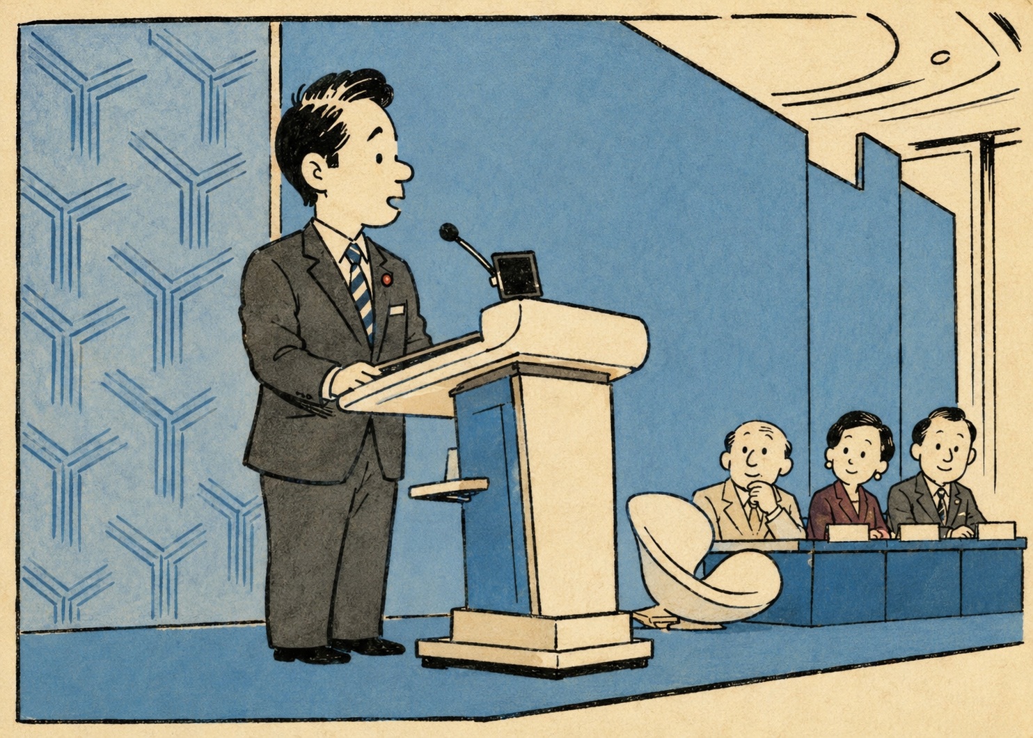 Man in a dark suit speaking at a podium with a microphone, addressing three panelists seated at a blue table in a conference or press briefing setting.