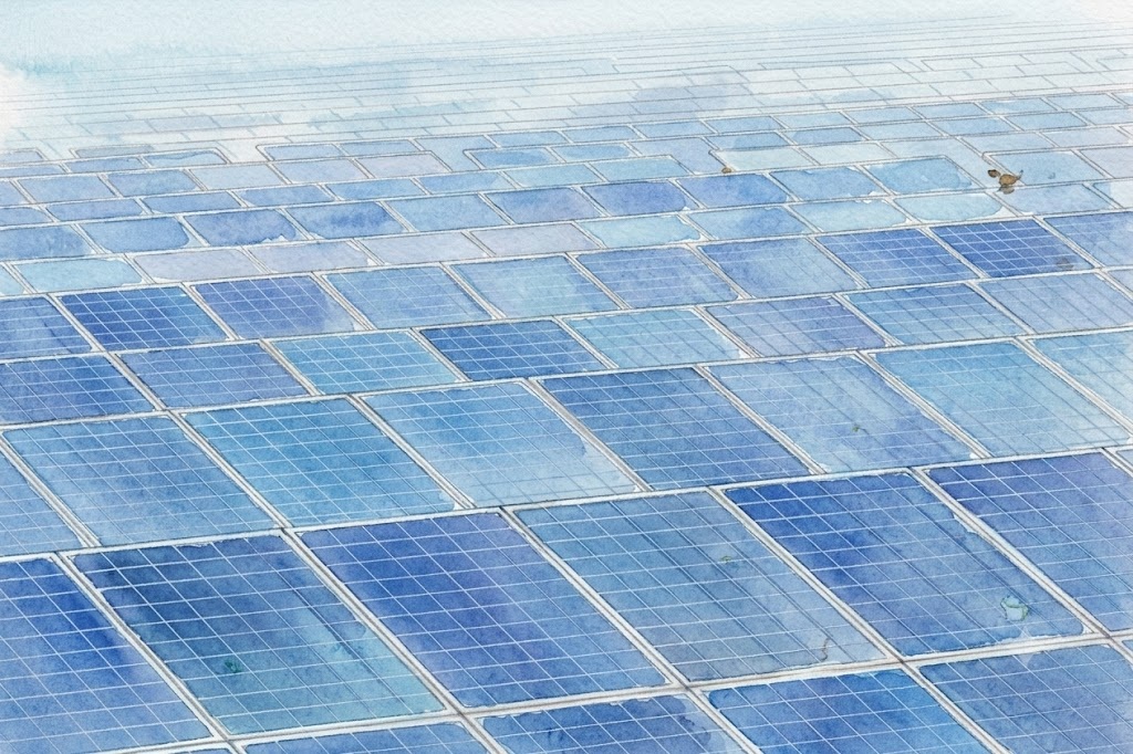 Extensive grid of blue solar panels covering a solar farm.